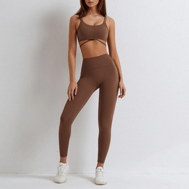 Seamless brown gym sports suit with bra and leggings for women, made from stretchy nylon and spandex, perfect for yoga and fitness.